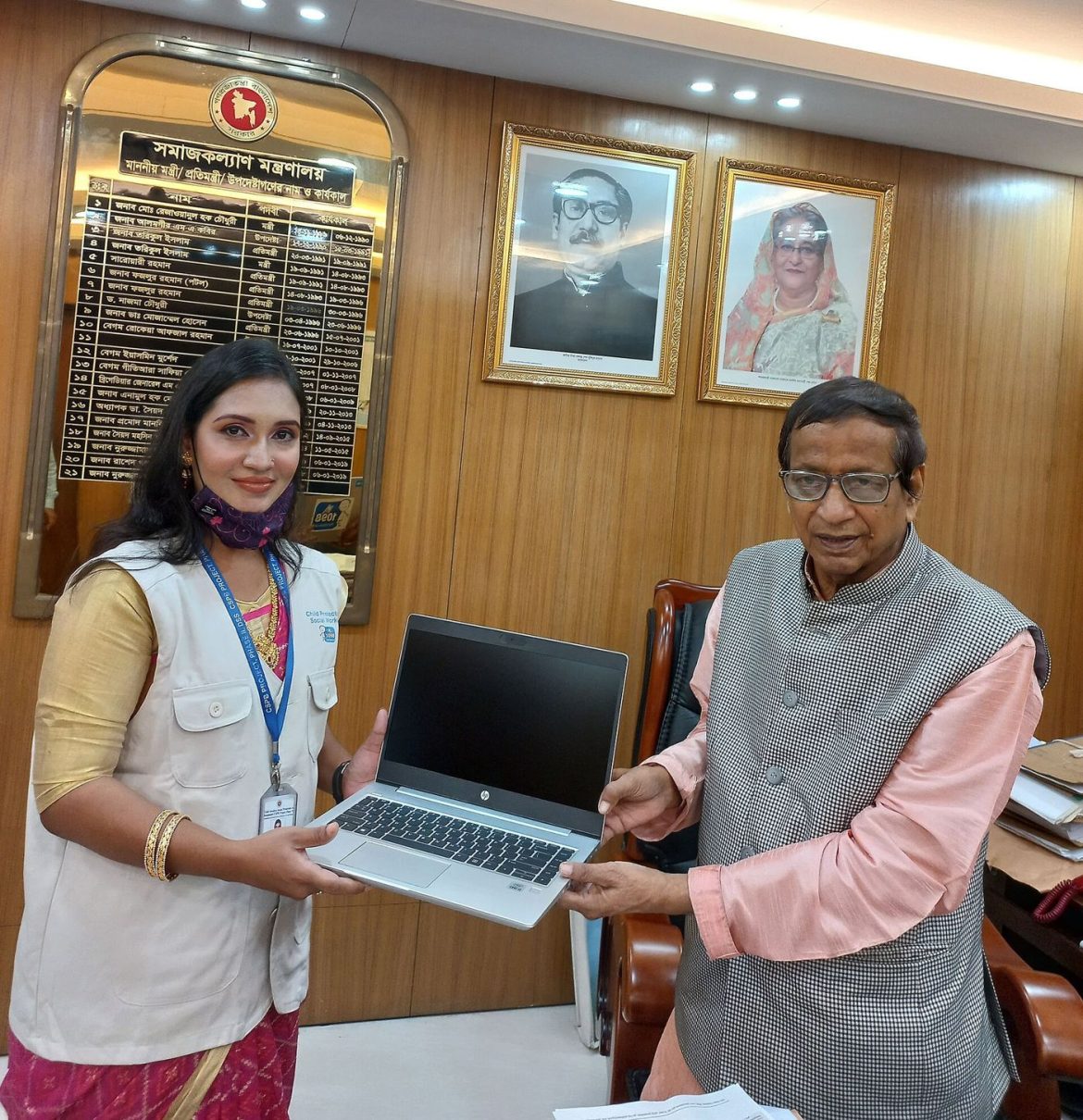 office workers working on laptops at their desks